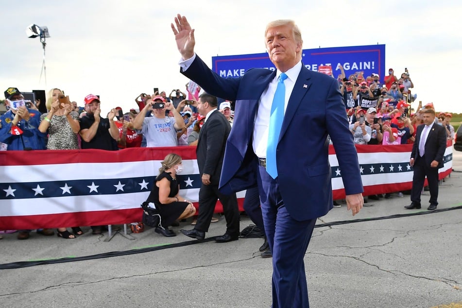 Donald Trump waving as he arrives for a campaign event at Arnold Palmer Regional Airport in Latrobe, Pennsylvania on September 3, 2020.