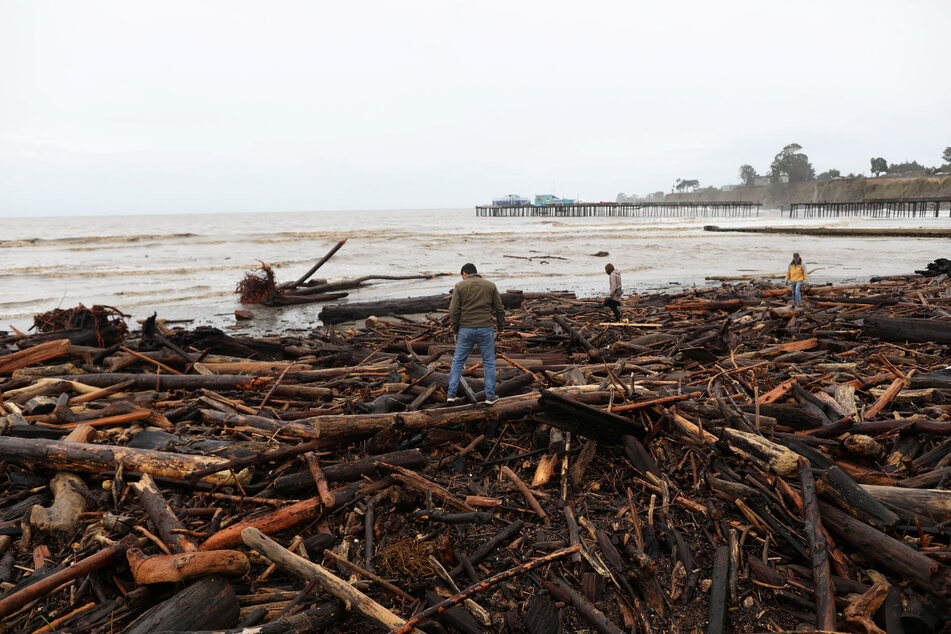 The flooding left huge quantities of driftwood in Capitola, California.