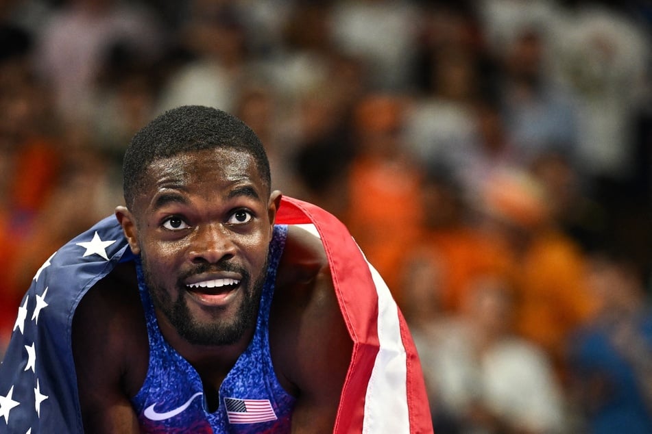 US' Rai Benjamin celebrates after winning the men's 400m hurdles final of the athletics event at the Paris 2024 Olympic Games at Stade de France in Saint-Denis, north of Paris, on Friday.