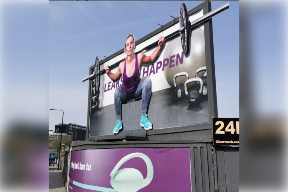 The Elvie billboard sits above Quaker Street in Shoreditch, London, and features real running water trickling down.