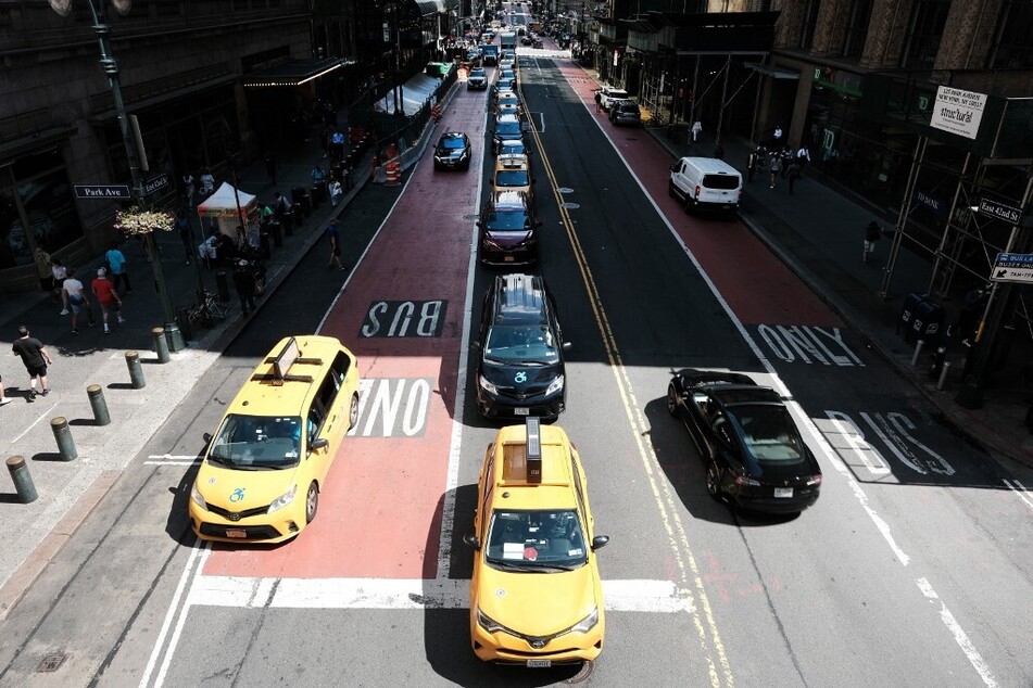 Traffic moves through midtown Manhattan in New York City.