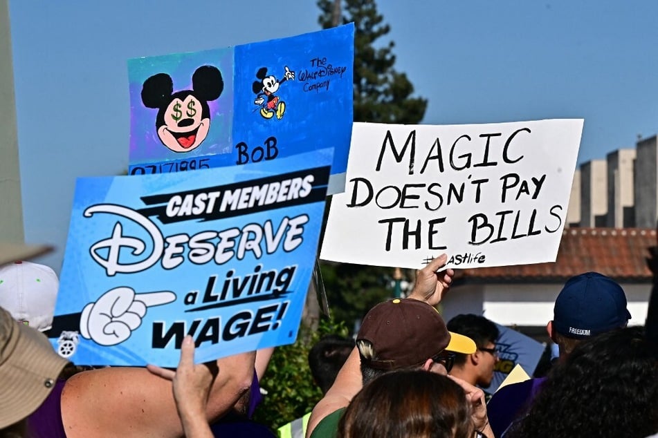 Disney employees rally outside the main entrance of Disneyland Resort in Anaheim, California.