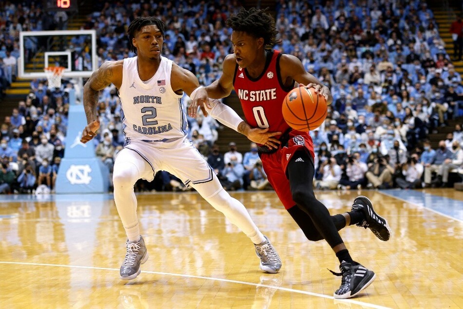 Terquavion Smith drives to the basket in a game against the North Carolina Tar Heels.