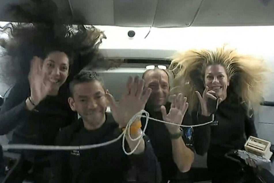 An image shows Polaris Dawn crew members (from l. to r.): mission specialist Sarah Gillis, commander Jared Isaacman, pilot Scott Poteet, and mission specialist and medical officer Anna Menon.