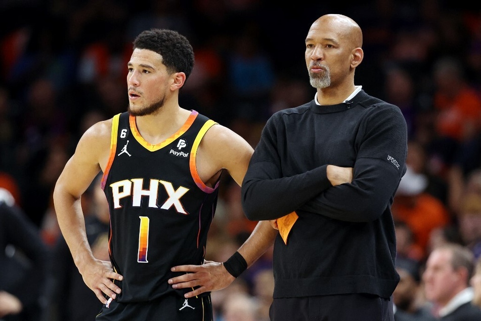 Devin Booker stands with Phoenix Suns head coach Monty Williams during the second quarter against the Denver Nuggets in Game 6 of the Western Conference Semifinal Playoffs.