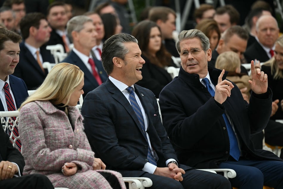 Defense Secretary Pete Hegseth (c.) posted a disturbing image to X showing Franklin the Turtle shooting and killing people.