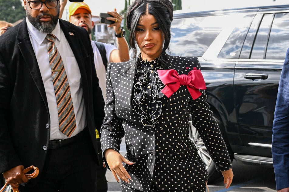 Cardi B had a heated response towards a photographer who asked about the paternity of her alleged fourth baby amid rumors she's expecting again.