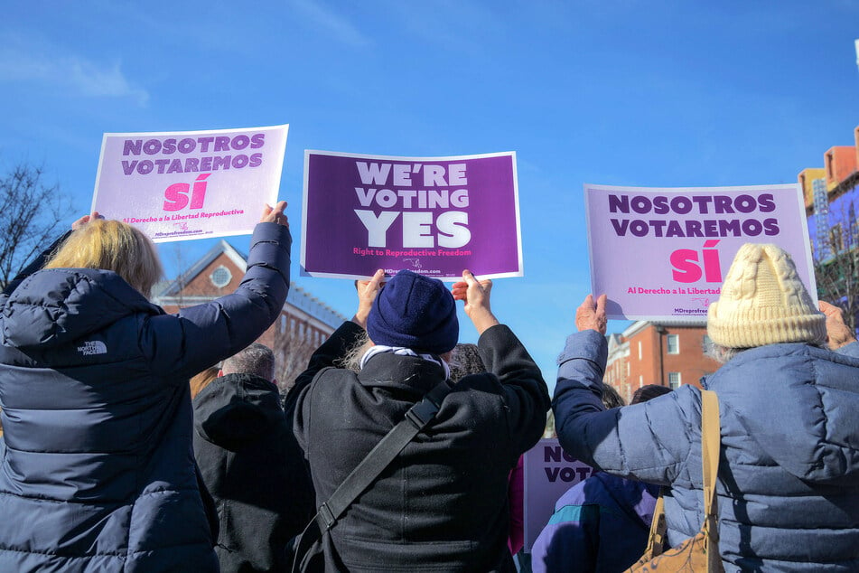 Activists in Annapolis raise signs in support of the constitutional amendment to protect abortion rights on the November 2024 ballot in Maryland.