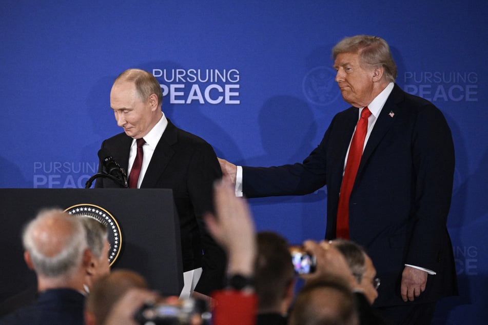 US President Donald Trump (r.) and Russian President Vladimir Putin (l.) walk away after delivering a joint press conference after participating in a US-Russia summit on Ukraine at Joint Base Elmendorf-Richardson in Anchorage, Alaska, on Friday.