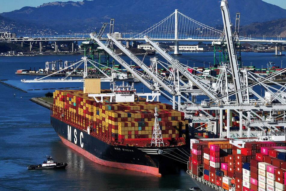 In an aerial view, container ships sit docked at the Port of Oakland on December 09, 2024 in Oakland, California.