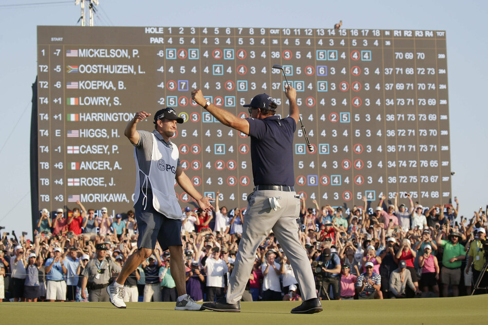 Mickelson celebrating his historic win.