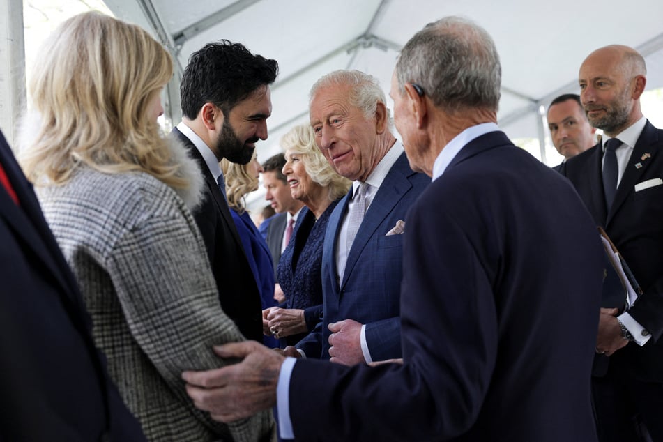 Britain's King Charles interacts with New York City Mayor Zohran Mamdani during a visit to the 9/11 Memorial in New York City on April 29, 2026.