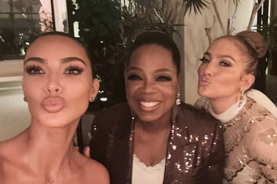 Kim Kardashian (l) and Jennifer Lopez were all smiles with Oprah (m) at a celebration for the anniversary of Anastasia Beverly Hills and Oprah's birthday.