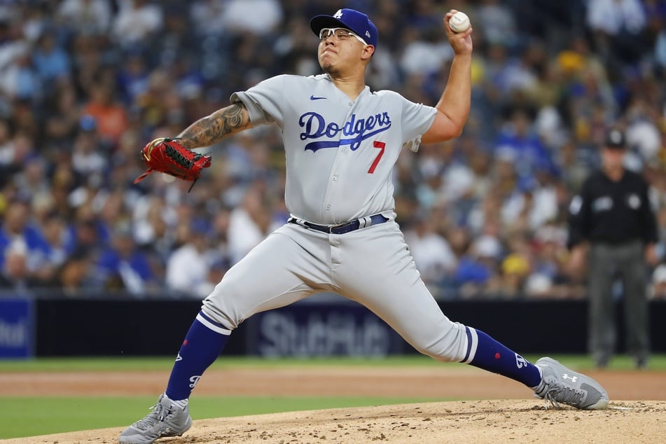 Dodgers pitcher Julio Urias struck out five and also batted in a run as Los Angeles beat San Francisco in game two.