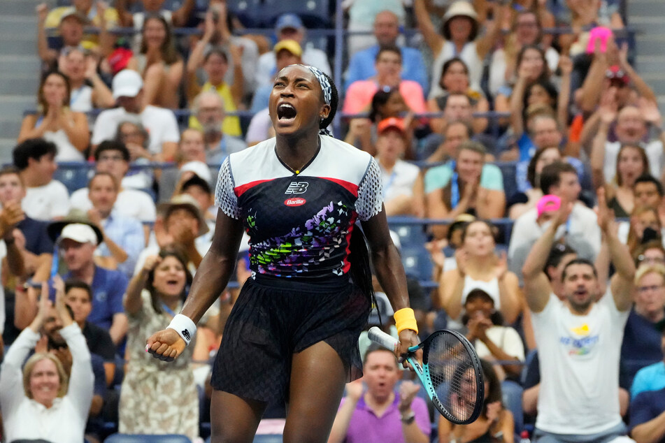 Coco Gauff celebrates with a cheering crowd after defeating Shuai Zhang in New York's Arthur Ashe Stadium.