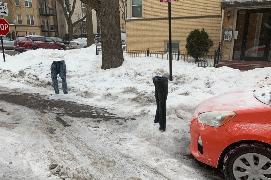 Selzer placed two pairs of frozen pants in the street to mark his preferred parking spot.