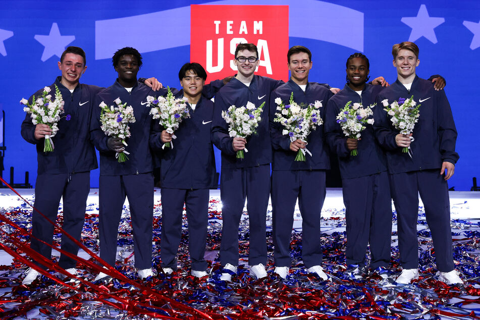 From l. to r.: Gymnasts Paul Juda, Frederick Richard, Asher Hong, Stephen Nedoroscik, and Brody Malone, along with alternates Khoi Young and Shane Wiskus, pose after being selected to represent the US at the Paris Olympics.