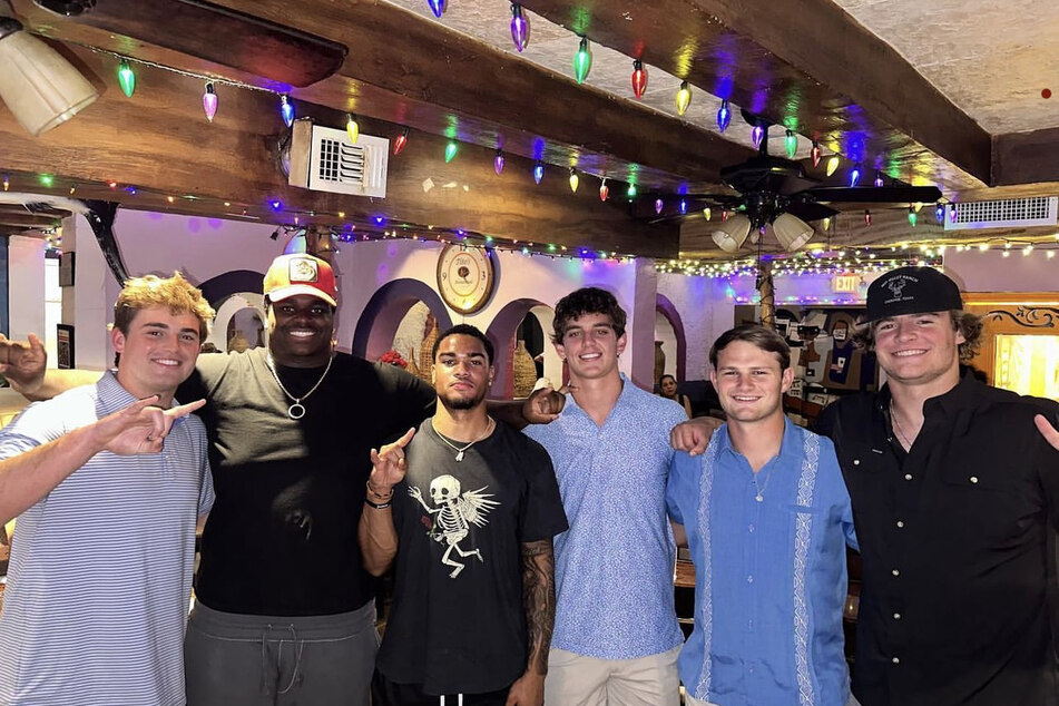 Freshman Texas quarterback Arch Manning (third from r.) had fans raving over his most recent Instagram post, which showed him with Texas football teammates and broke his long hiatus of social media posting.