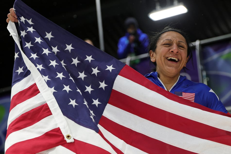Gold medalist Elana Meyers Taylor celebrates winning the women's monobob competition at the 2026 Milan Cortina Olympics.