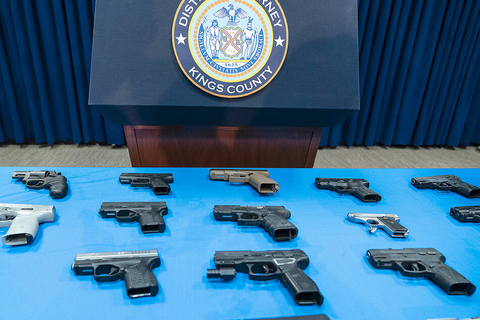 Brooklyn's DA displayed confiscated gang handguns January 4 press conference.