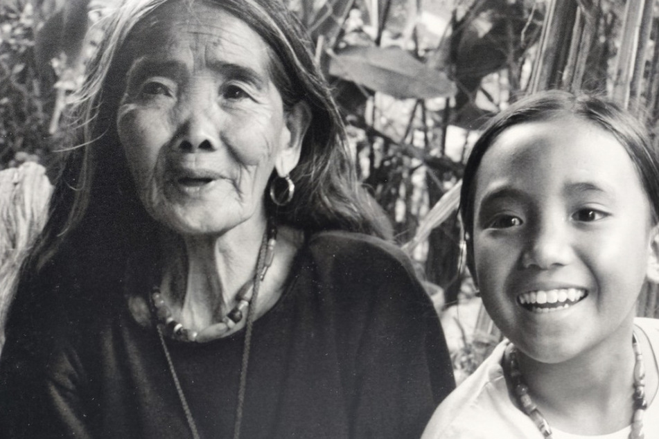 Whang-Od has taught her grandniece, Grace Palicas (r.), the art of traditional tattooing.