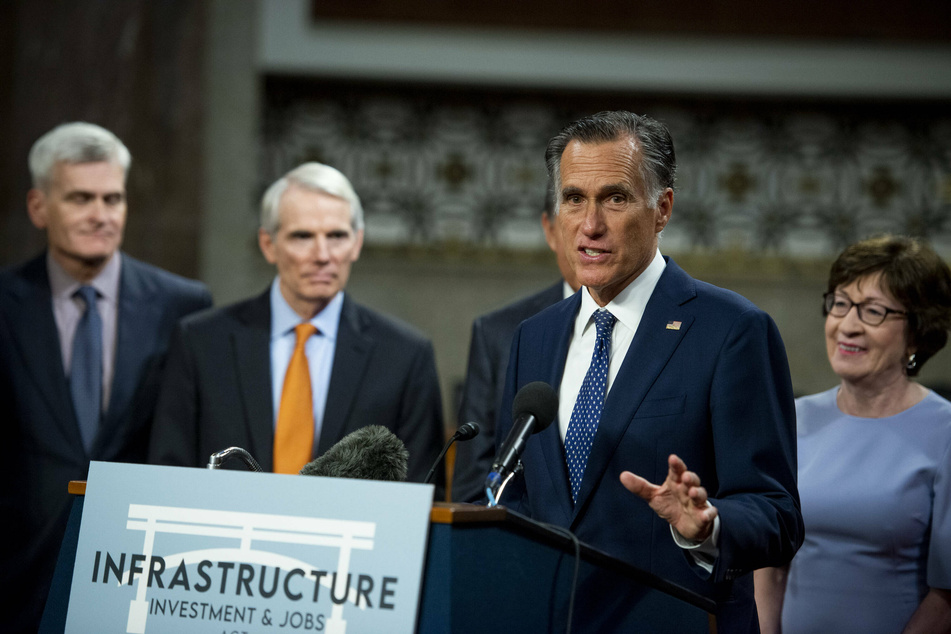 Republican Senator Mitt Romney delivers remarks in favor of the bipartisan infrastructure bill.