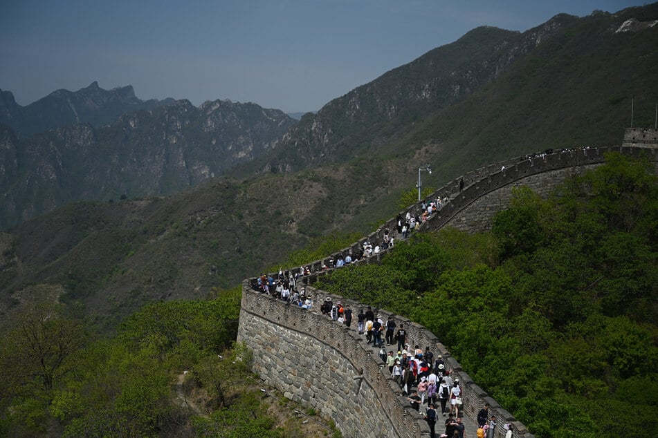 The Great Wall of China, a UNESCO World Heritage site, has been dealt "irreversible damage" by two construction workers looking for a shortcut.
