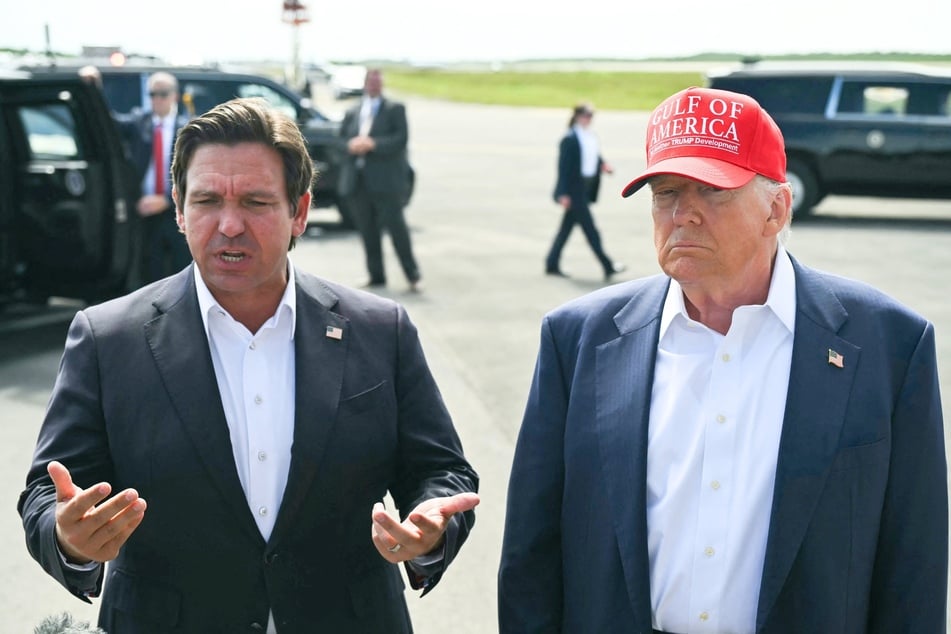 President Donald Trump (r.) joined Florida Governor Ron DeSantis for the opening of a new migrant detention center on Tuesday.