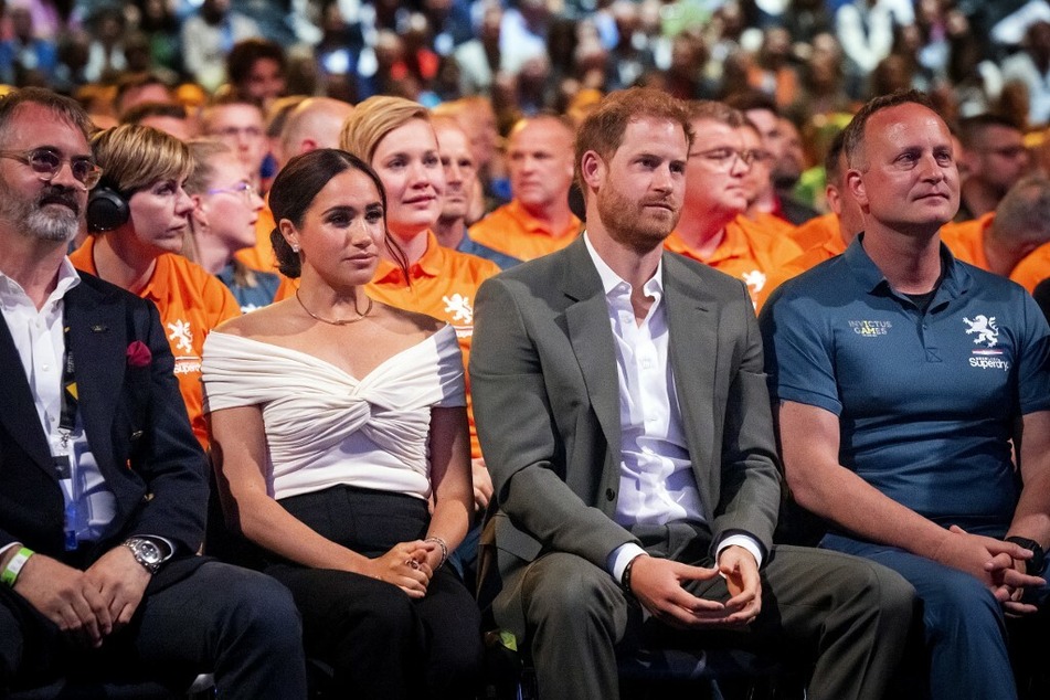 Meghan Markle and Prince Harry (c.) at the opening ceremony of the Invictus Games in The Hague, Netherlands.