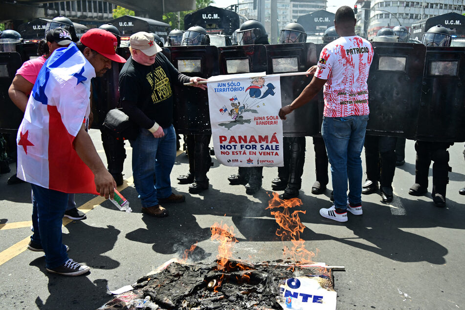 Demonstrators burn an allusive sign during a protest against the visit of US Secretary of State Marco Rubio in Panama City on Sunday.