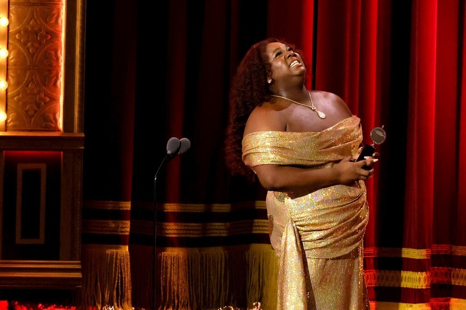Alex Newell accepts the award for Best Featured Actor in a Musical for Shucked onstage during The 76th Annual Tony Awards at United Palace Theater on June 11, 2023, in New York City.