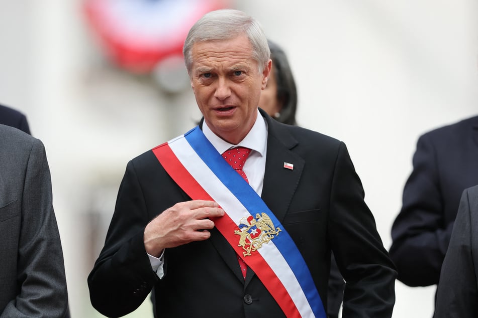 Chile's President Jose Antonio Kast poses for a picture with members of his government at La Moneda presidential palace in Santiago on March 12, 2026.