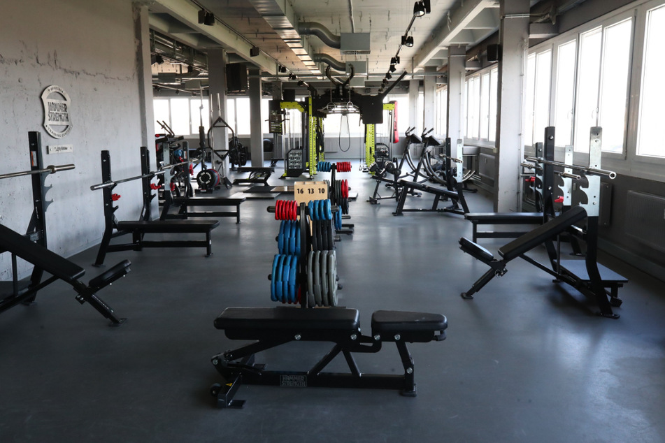 Exercise equipment is in an empty sports center.  After a long wait, the fitness centers in Dresden are finally allowed to reopen.