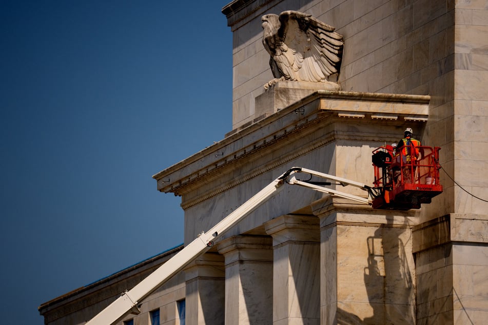 The front facade of the Marriner S. Eccles Federal Reserve Board Building is visible as a massive renovation continues in Washington DC.