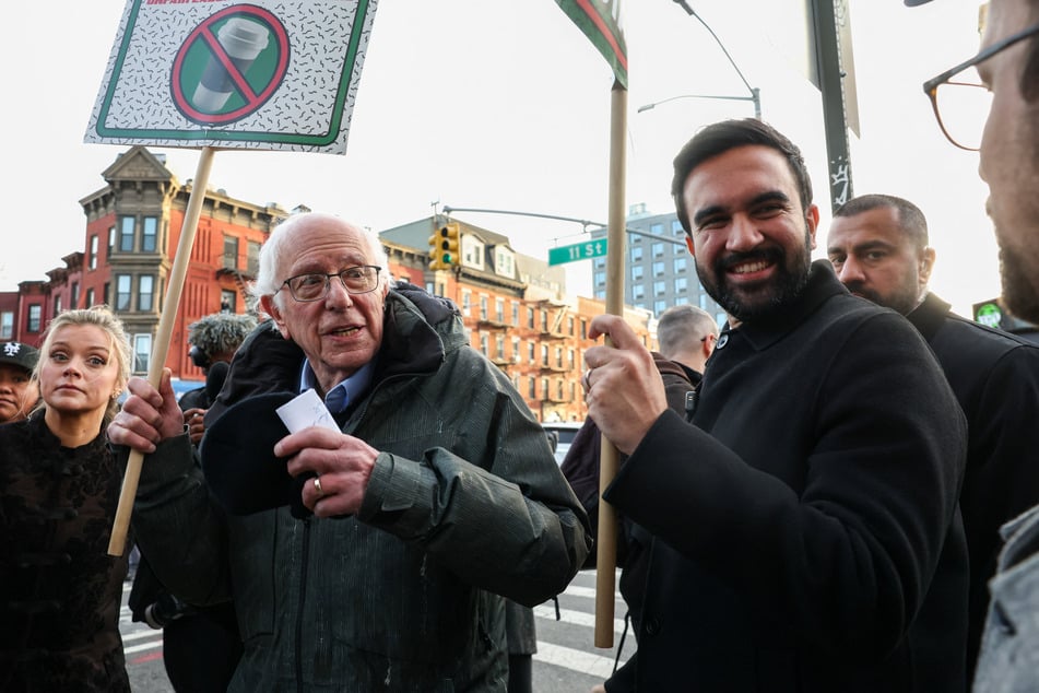 Senator Bernie Sanders and New York City Mayor-elect Zohran Mamdani march alongside Starbucks workers outside a cafe in Brooklyn on December 1, 2025.