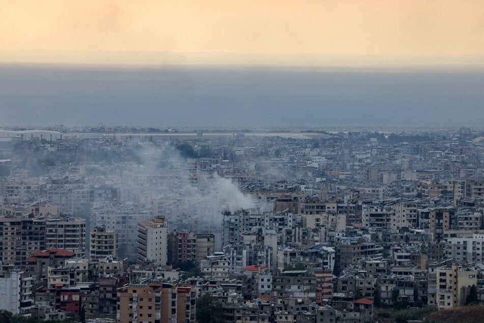 Smoke billows from the site of an Israeli air strike that targeted a neighborhood in Beirut's southern suburbs on Sunday.