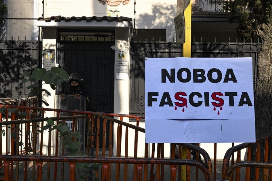 A sign reading "Noboa Fascist" is on display during a protest outside the Ecuadorian embassy in Mexico City on April 6, 2024.