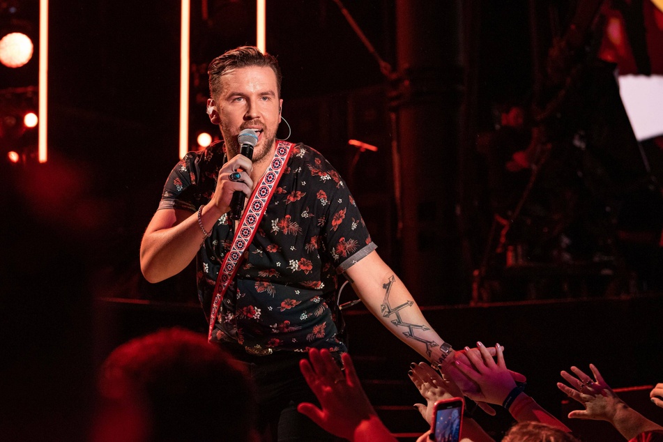 T.J. Osborne performing on stage during day one of 2019 CMA Music Festival in Nashville, Tennessee.