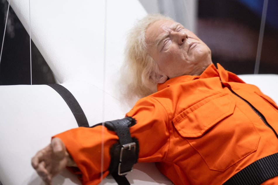 Sculpture of Trump strapped to a cross goes on display: "Saint or sinner"