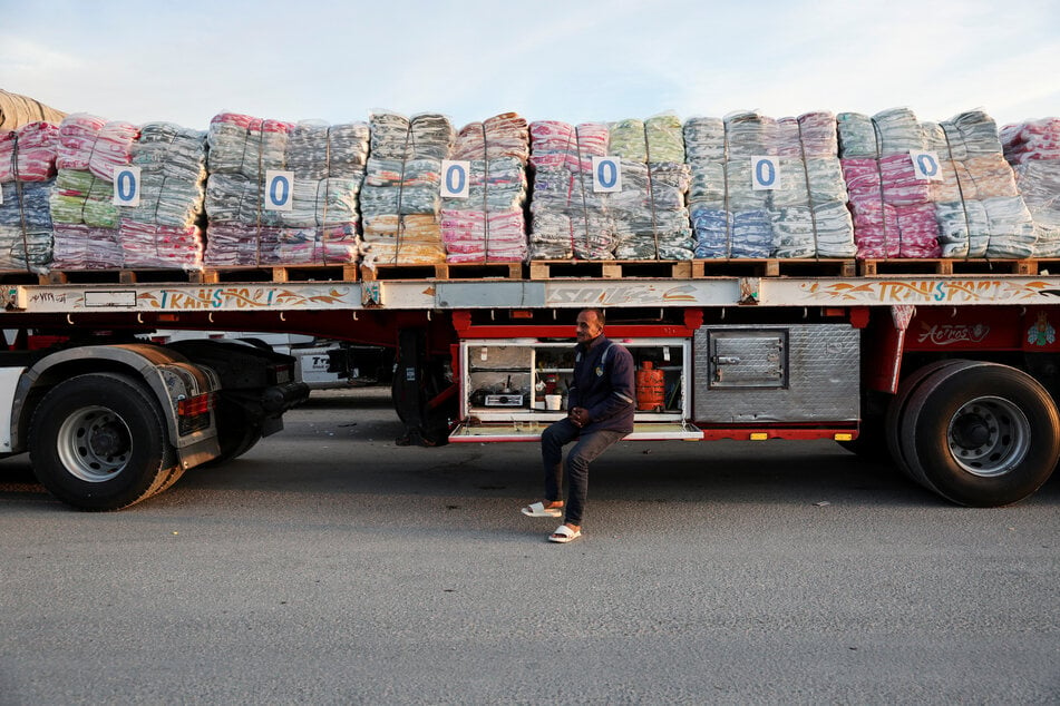 Aid trucks waiting to enter Gaza as part of the first phase of the ceasefire agreement.