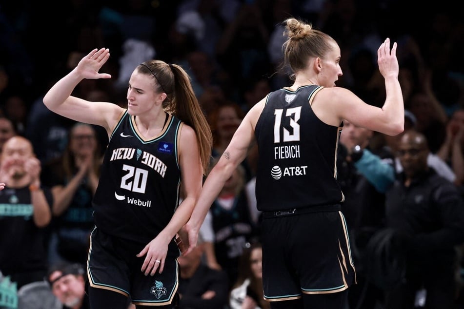 Sabrina Ionescu (l.) and Leonie Fiebich of the New York Liberty celebrate during the fourth quarter of Game 2 of the WNBA Finals.