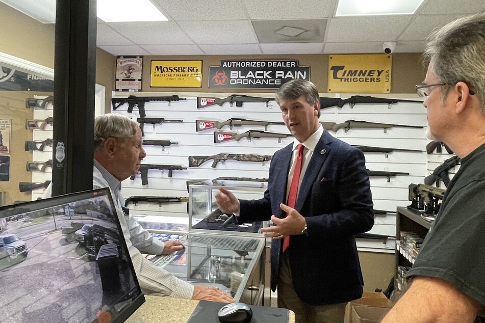 Alabama Rep. Barry Moore (c.) appears at a Troy gun shop to announce a bill that would make the AR-15 the "National Gun of the United States."