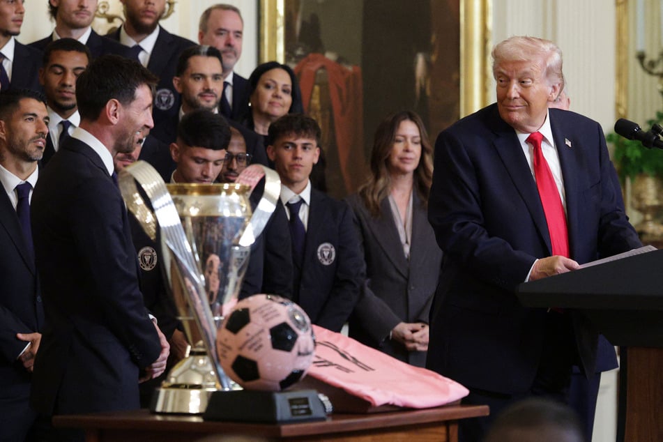 Lionel Messi (l.) of Inter Miami CF watches as President Donald Trump speaks in the East Room of the White House on March 5, 2026.