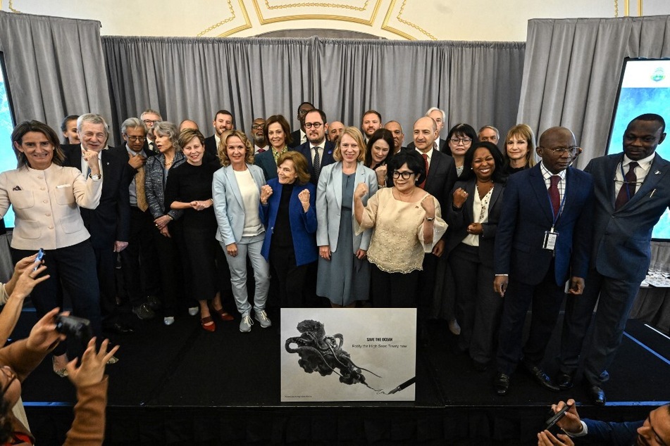 United Nations attendees, including actors Jane Fonda and Sigourney Weaver, pose for a photo as the High Seas Treaty opens for signatures.