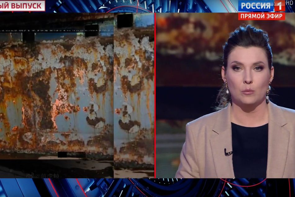 Propagandistin Skabejewa präsentiert ihren "Beweis" - eine rostige Stahlplatte.