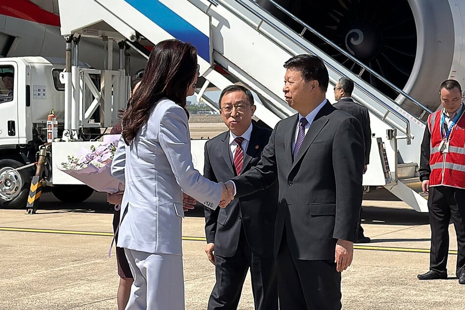 Kuomintang Chairperson Cheng Li-wun (l.) shakes hands with Song Tao, Director of the Taiwan Work Office of the Communist Party of China Central Committee and Taiwan Affairs Office of the State Council, in Shanghai.