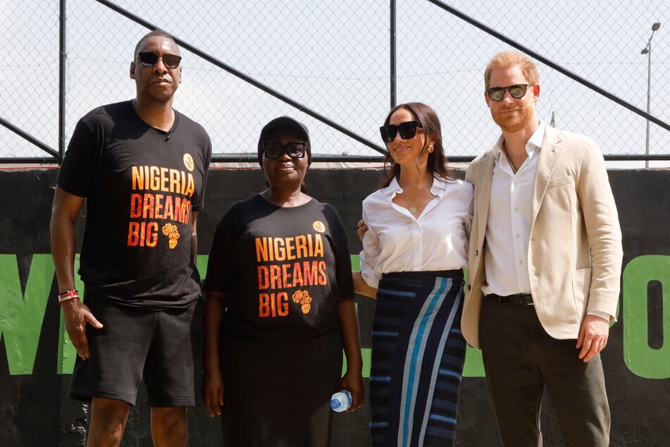 Prince Harry (far r.) and Meghan Markle (center r.) visited Nigeria to promote the Invictus Games, which were founded by the Duke of Sussex in 2014.