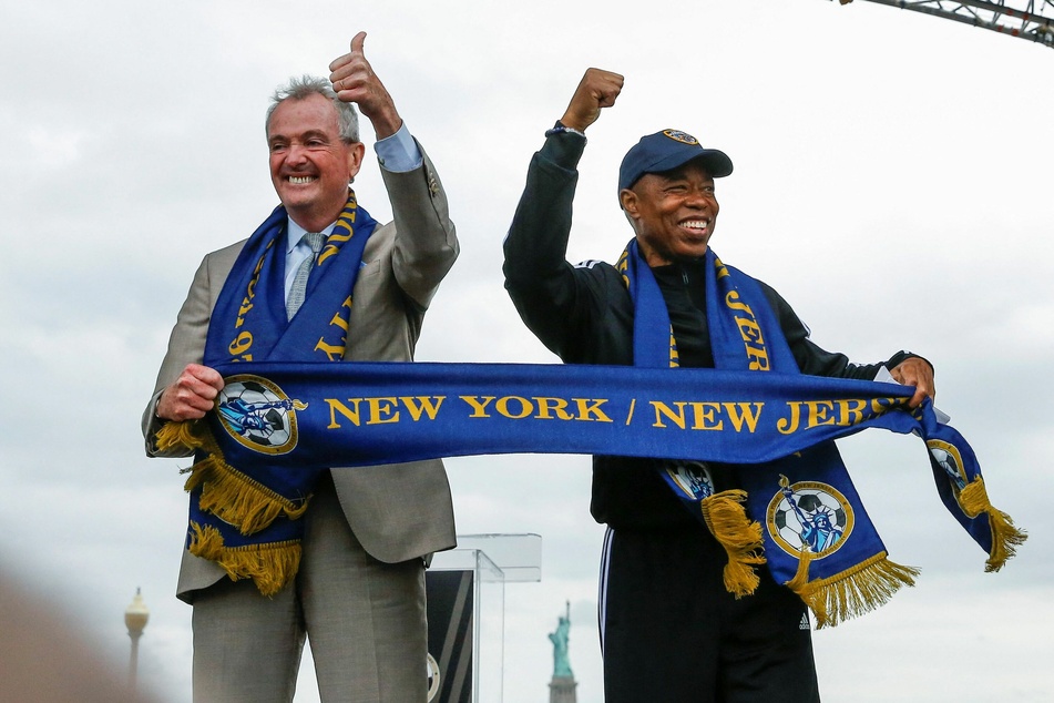 New Jersey Governor Phil Murphy and New York City Mayor Eric Adams celebrate at a watch party in Liberty State Park.