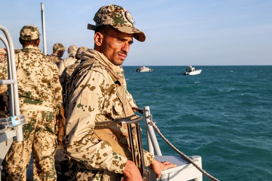 A Yemeni coastguard member rides in a patrol boat in the Red Sea off the town of Mokha in the western Taiz province.