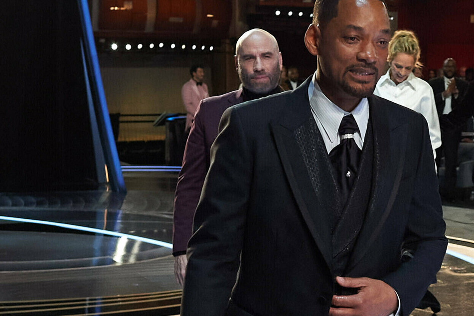 Will Smith leaving the stage at Sunday's Oscars, where he slapped comedian Chris Rock.